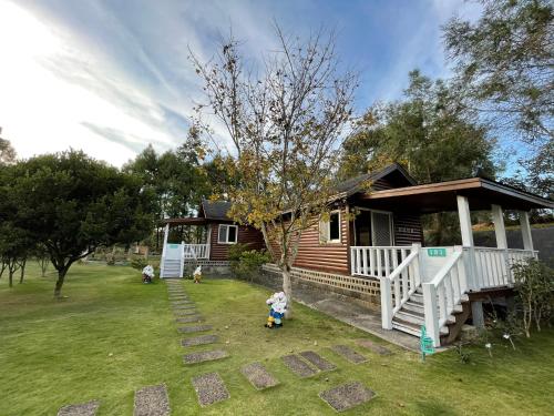 a small house with two children in front of it at View on View B&B in Puli