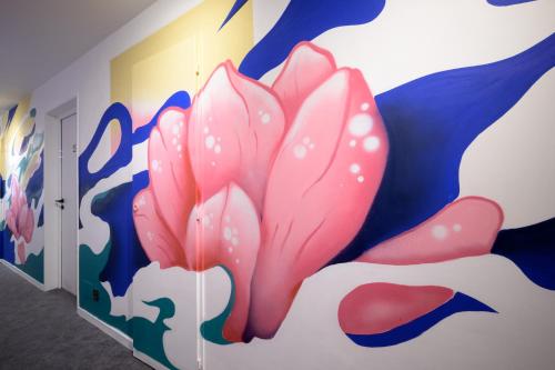 a mural of a flower on a wall at L'Outa Hotel Restaurant in Termignon