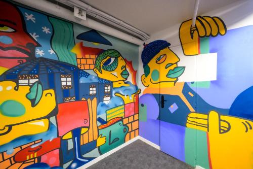 a room with a mural on the wall at L'Outa Hotel Restaurant in Termignon