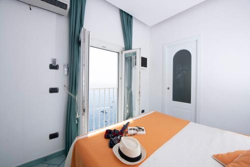 Ένα ή περισσότερα κρεβάτια σε δωμάτιο στο Hotel La Ninfa