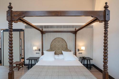 Postel nebo postele na pokoji v ubytování Parador de Turismo de León
