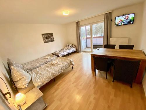 a living room with a couch and a table at Gemütliches WG-Zimmer 4, zentral in Ravensburg (stadtnah), Balkon in Ravensburg