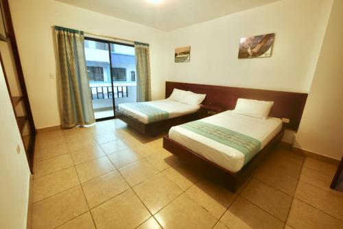 Cama o camas de una habitación en Hotel Galapagos Paradise
