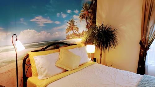 a bedroom with a bed with a painting of the beach at Kokomo INN Bed and Breakfast Ottawa-Gatineau's Only Tropical Riverfront B&B on the National Capital Cycling Pathway Route Verte #1 - for Adults Only - Chambre d'hôtes tropical aux berges des Outaouais BnB #17542O in Ottawa