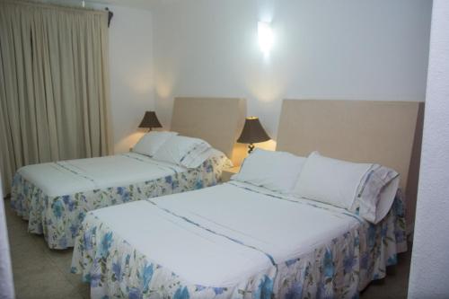 เตียงในห้องที่ Los Mangos