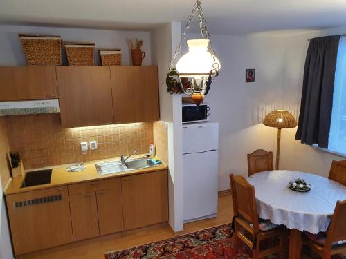 A kitchen or kitchenette at Apartments Michalka - ap. dom Skalka