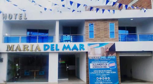 a building with a sign for a marina del mar at Hotel Maria del Mar in Planeta Rica