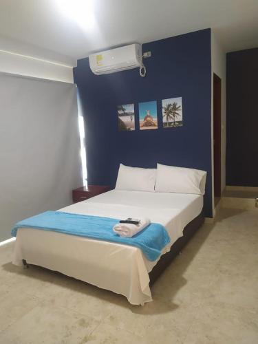 Giường trong phòng chung tại Hotel Maria del Mar