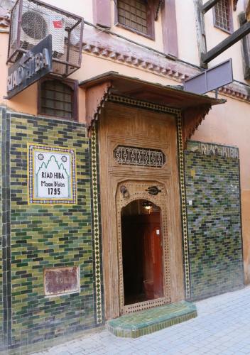an entrance to a building with a sign on it at Riad Hiba in Meknès