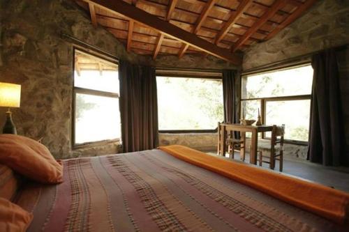 Postel nebo postele na pokoji v ubytování Cabañas Las Perdices de Candonga