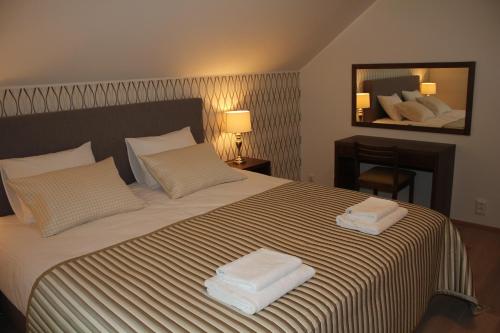 Ένα ή περισσότερα κρεβάτια σε δωμάτιο στο Marina Holiday Honka Village Apartments
