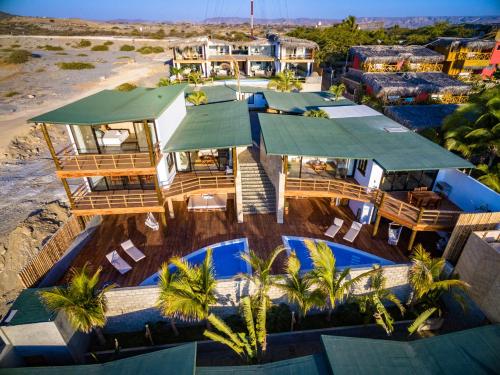 an aerial view of a resort with a swimming pool at Casas Lua & Mar - Vichayito - Máncora in Vichayito