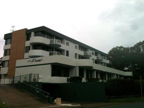 a large white building with the words her private at The Point, 5, 5-7 Mitchell Street large balcony with great water views in Soldiers Point