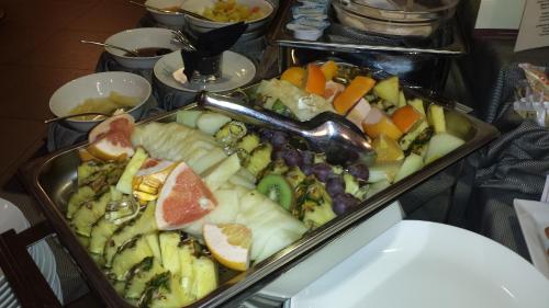 a tray of fruits and vegetables on a table at Best Western Plus Hotel Monza e Brianza Palace in Cinisello Balsamo