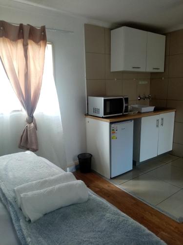 Η κουζίνα ή μικρή κουζίνα στο Lior-Gil accommodation-
