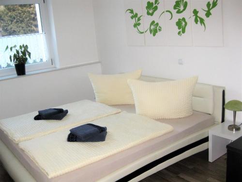 Ένα ή περισσότερα κρεβάτια σε δωμάτιο στο Ferienwohnung Becker