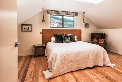 a bedroom with a large bed and a window at Miners Lane B&B in Clyde