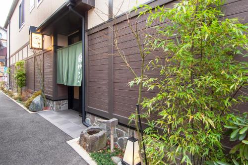 a building with a sign on the side of it at Oyado Yukizumi in Kusatsu