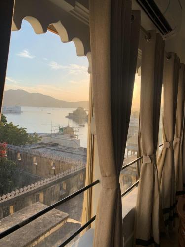 a view of the ocean from a window at Hotel The Tiger in Udaipur