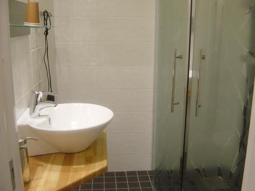 a bathroom with a sink and a shower at Söråkers Herrgård in Söråker
