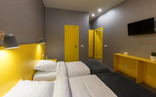 Un pat sau paturi într-o cameră la Отель Баларам