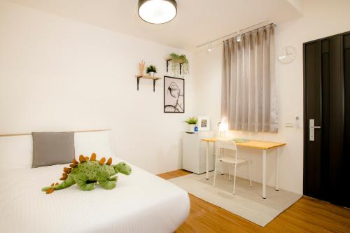 Ένα ή περισσότερα κρεβάτια σε δωμάτιο στο Xiao Dong Quiao Yu