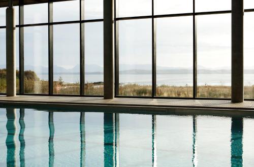 a view from a balcony of a swimming pool at Isle Of Mull Hotel and Spa in Craignure