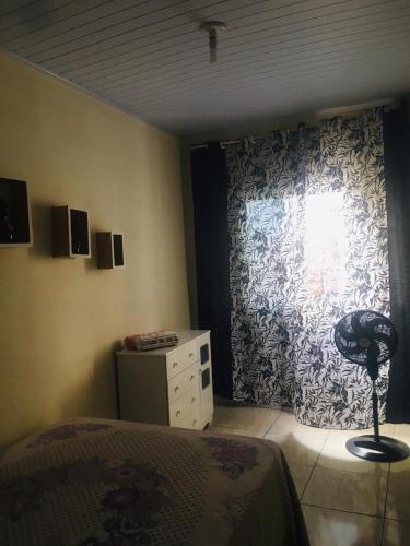 Кровать или кровати в номере CASA DE VERANEIO EM ILHÉUS