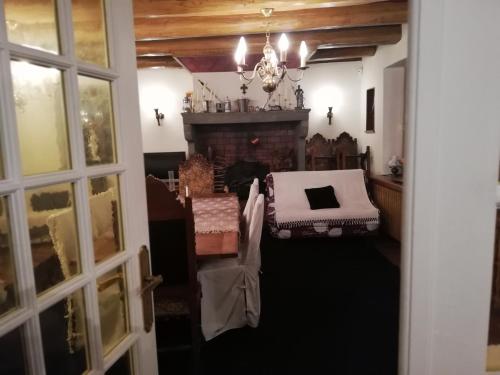 a living room with a bed and a fireplace at Fouettara in Firminy