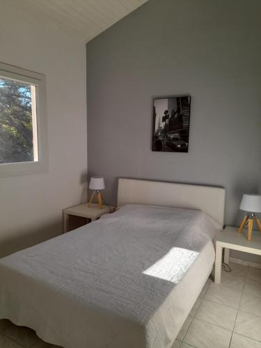 Ένα ή περισσότερα κρεβάτια σε δωμάτιο στο Appartement SOULAC SUR MER À 500 m de la plage N 1