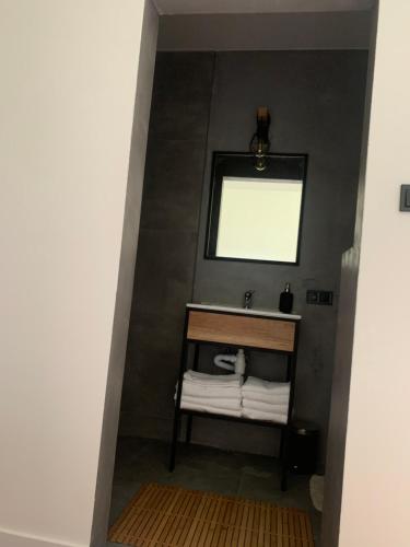 a bathroom with a sink and a mirror at Agro na Wapniarni in Białla