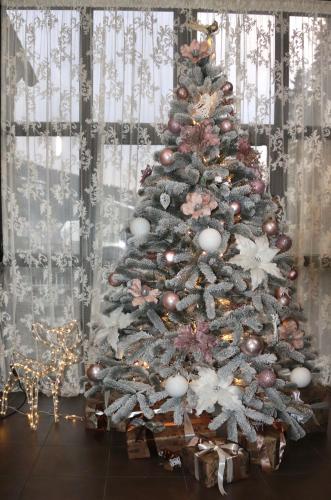 a christmas tree with ornaments on it at Маєток "ZYMON & SKI" in Bukovel