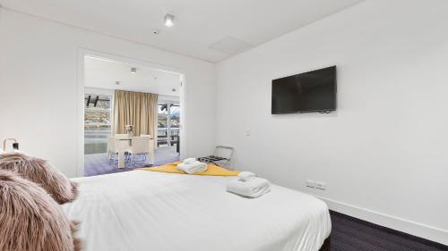 En eller flere senger på et rom på Marina Views - Apt 207