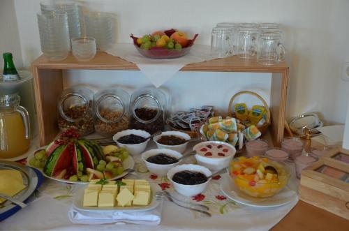 a table topped with lots of different types of food at Hotel zur Brücke in Greifswald