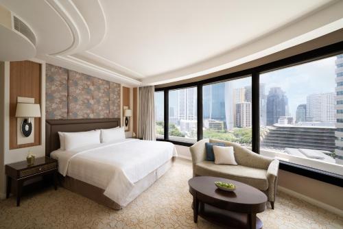 Un ou plusieurs lits dans un hébergement de l'établissement Edsa Shangri-La, Manila
