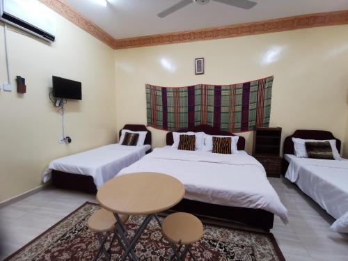 Tempat tidur dalam kamar di Salassel Al Jabal Al Akhdar Guesthouse