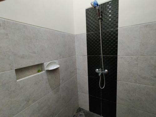 Ванная комната в Abadi Homestay