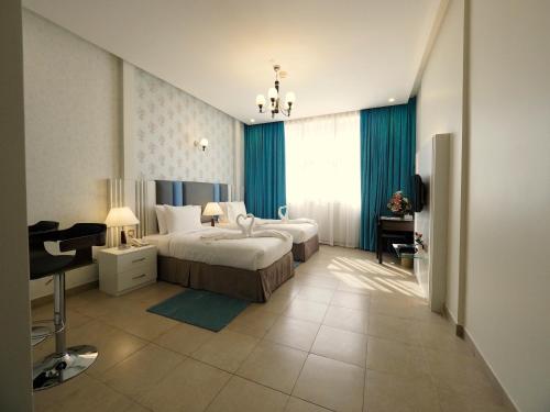 Ένα ή περισσότερα κρεβάτια σε δωμάτιο στο Skylark Hotel Apartments AL Barsha