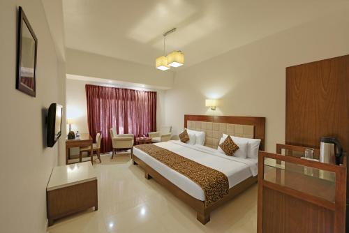 A bed or beds in a room at Turban Valley View Resort and Spa, Udaipur