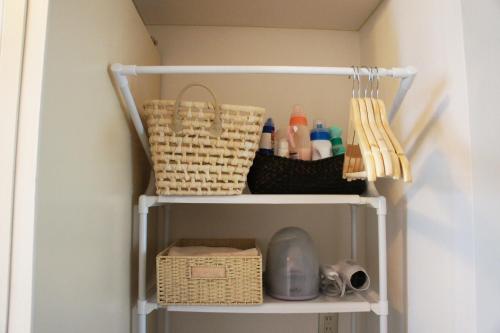 a white shelf with items on it in a room at Lucy's House横浜中華街 House5 in Yokohama