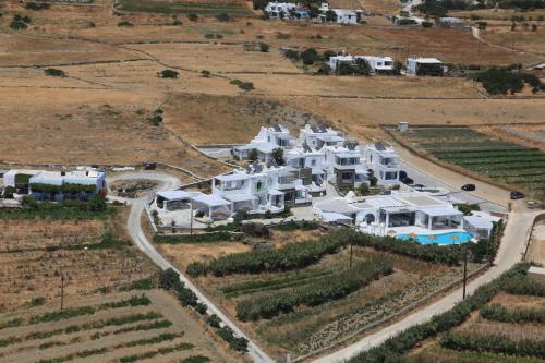 an aerial view of a large white house at Anthea Hotel in Tinos Town