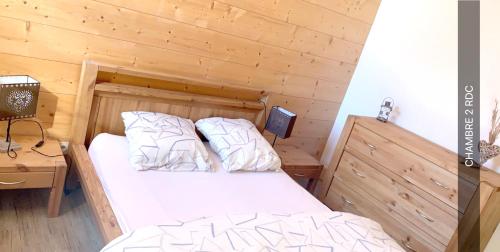 Ένα ή περισσότερα κρεβάτια σε δωμάτιο στο Chalet accueillant avec vue sur la montagne - 180 m² - Valmorel