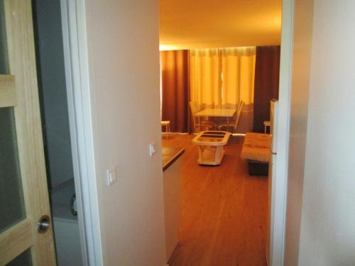 a room with a living room and a dining room at Appartement lumineux à Saint-Cyprien 45 m² vue mer in Saint-Cyprien