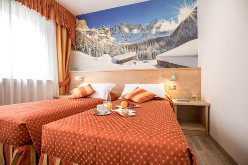 Llit o llits en una habitació de Hotel Touring