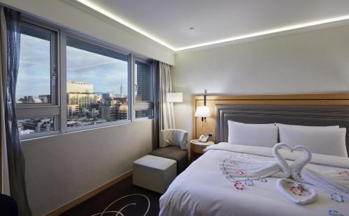 Postel nebo postele na pokoji v ubytování K Hotel Taipei Songjiang