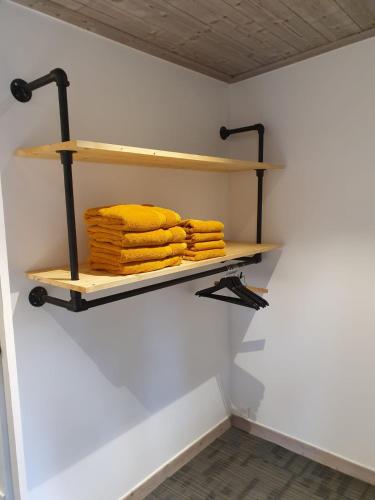 a shelf in a room with towels on it at Lodge Les Merisiers in Courchevel
