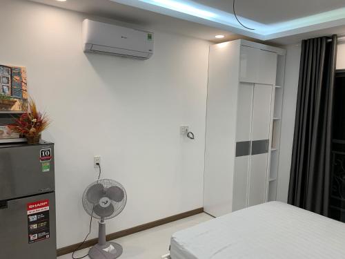 Ένα ή περισσότερα κρεβάτια σε δωμάτιο στο Smiley Apartment Quận 2