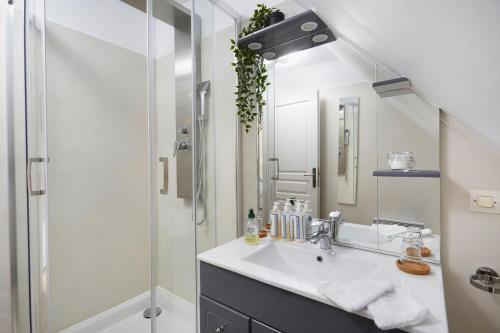 a bathroom with a sink and a shower at Domaine de Bersaillin in Bersaillin