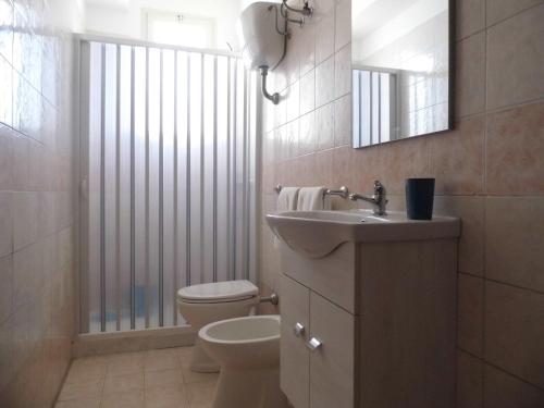 Ванна кімната в Residence La Poesia - Direzione Salento