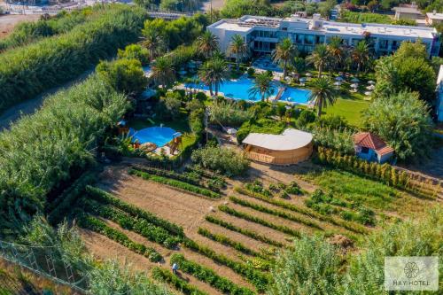 an aerial view of a resort with a garden at May Beach Hotel in Rethymno Town